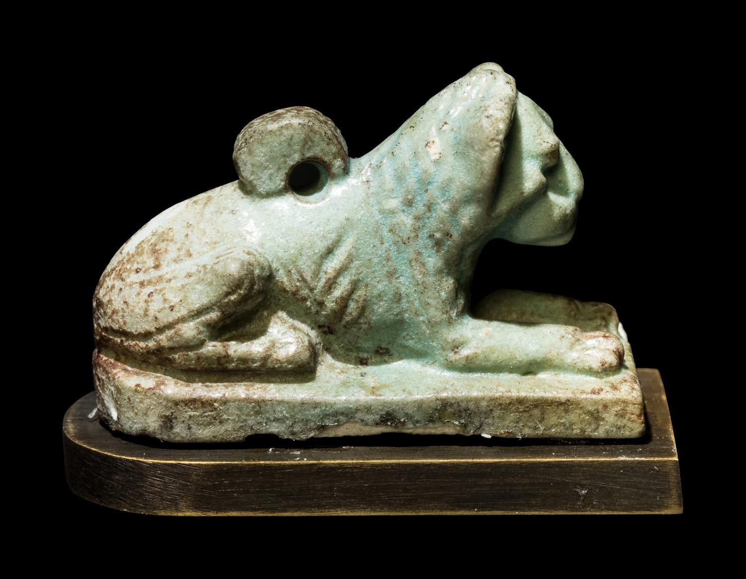 An Egyptian Faience Recumbent Lion