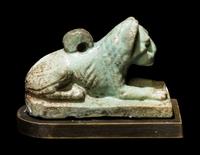 An Egyptian Faience Recumbent Lion