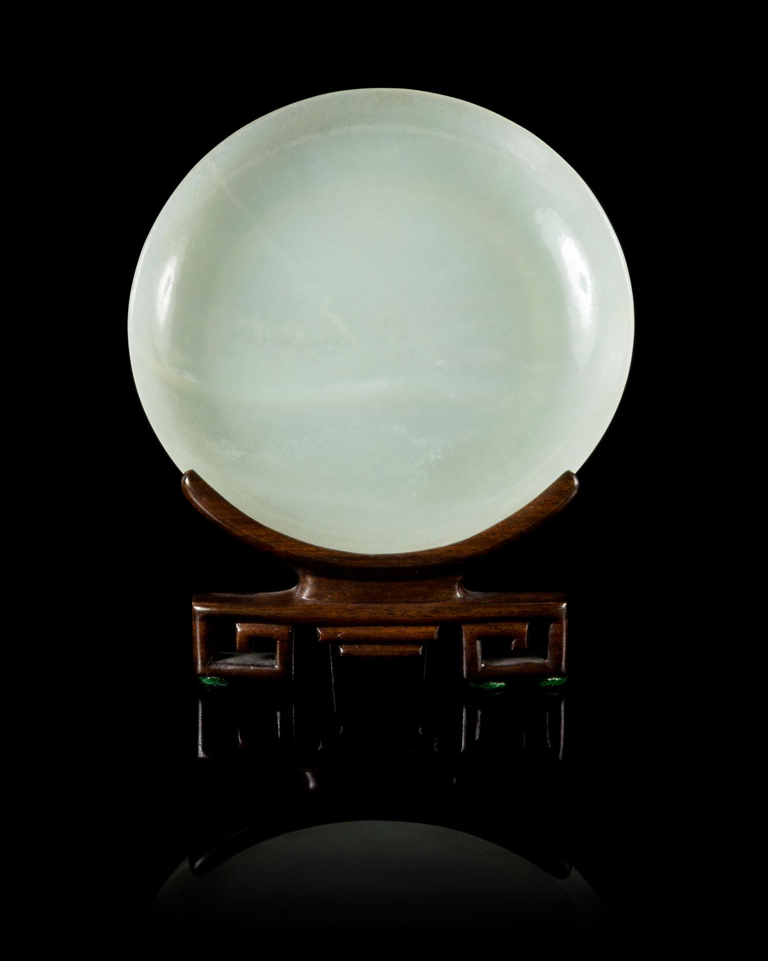 A Pale Celadon Jade Circular Dish Diameter 5 1/8 inches.