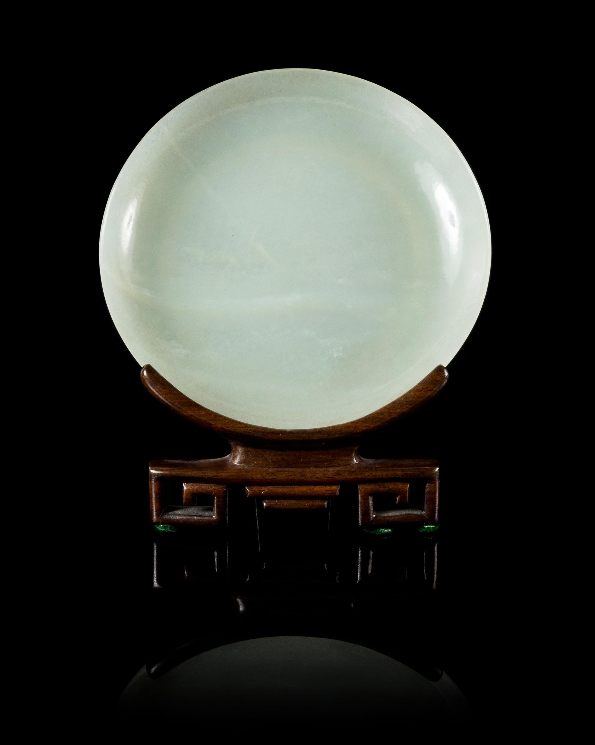 A Pale Celadon Jade Circular Dish Diameter 5 1/8 inches.