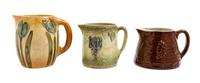 Three Uhl Pottery Pitchers Height of tallest 7 1/4 inches.