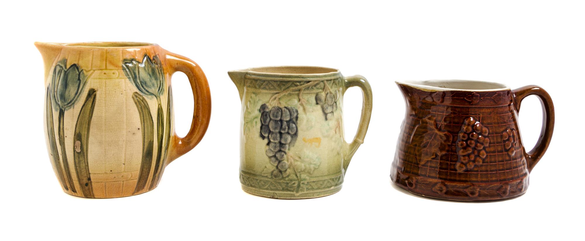 Three Uhl Pottery Pitchers Height of tallest 7 1/4 inches.