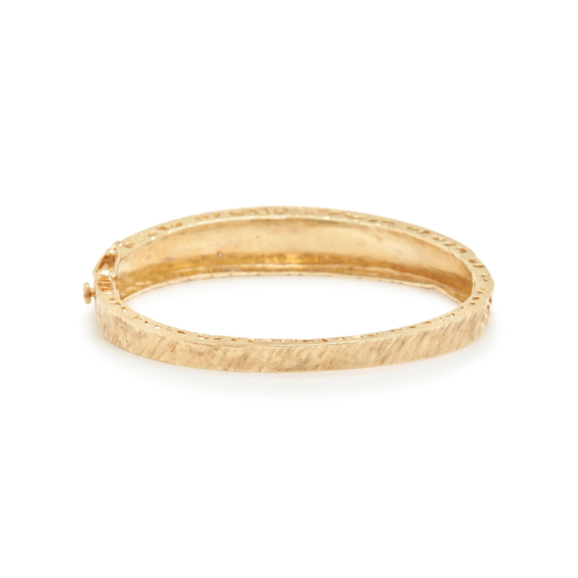 COLLECTION OF YELLOW GOLD AND DIAMOND BANGLE BRACELETS