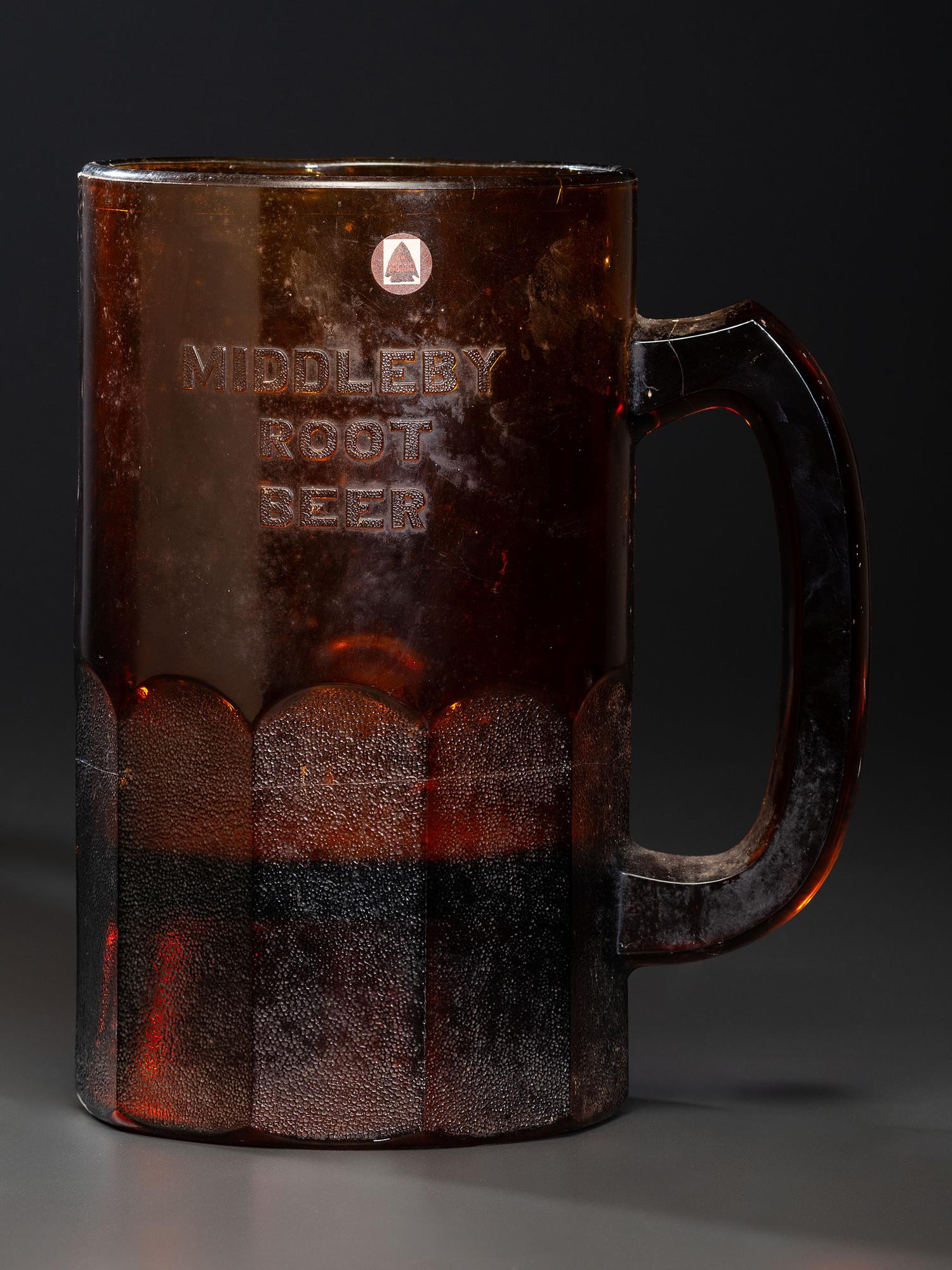 A 'Middleby Root Beer' Glass Countertop Syrup Dispenser