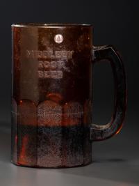 A 'Middleby Root Beer' Glass Countertop Syrup Dispenser
