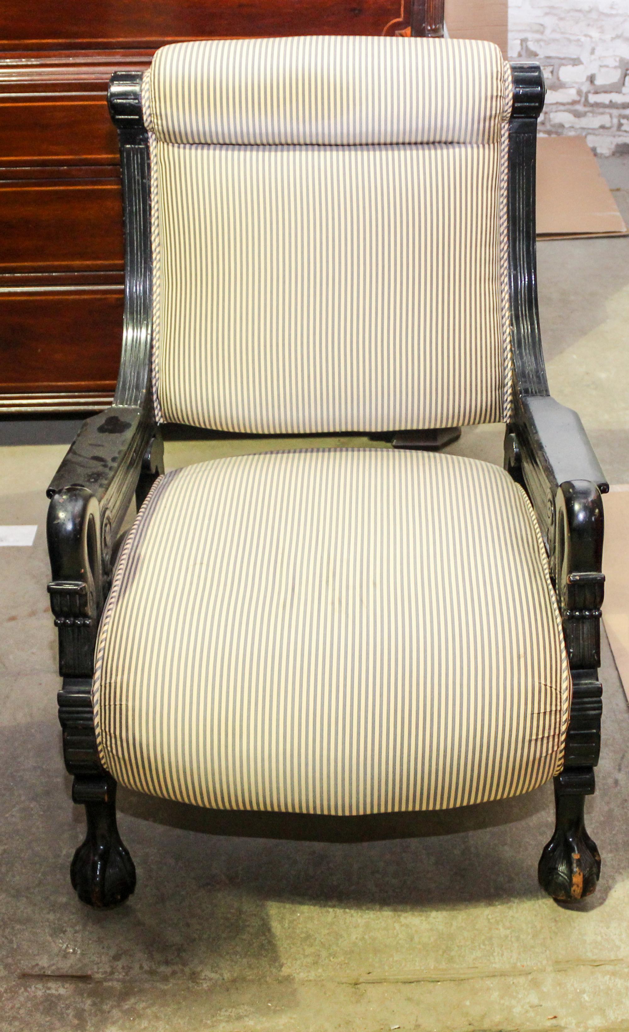 A Renaissance Revival Ebonized Armchair Height 37 1/2 inches.