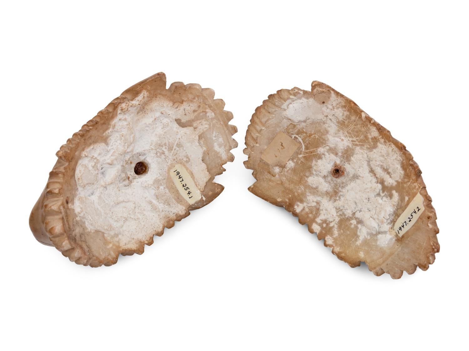 Two Continental Carved Alabaster Masks