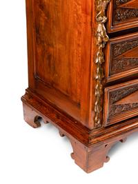 An Italian Baroque Style Walnut Chest of Drawers