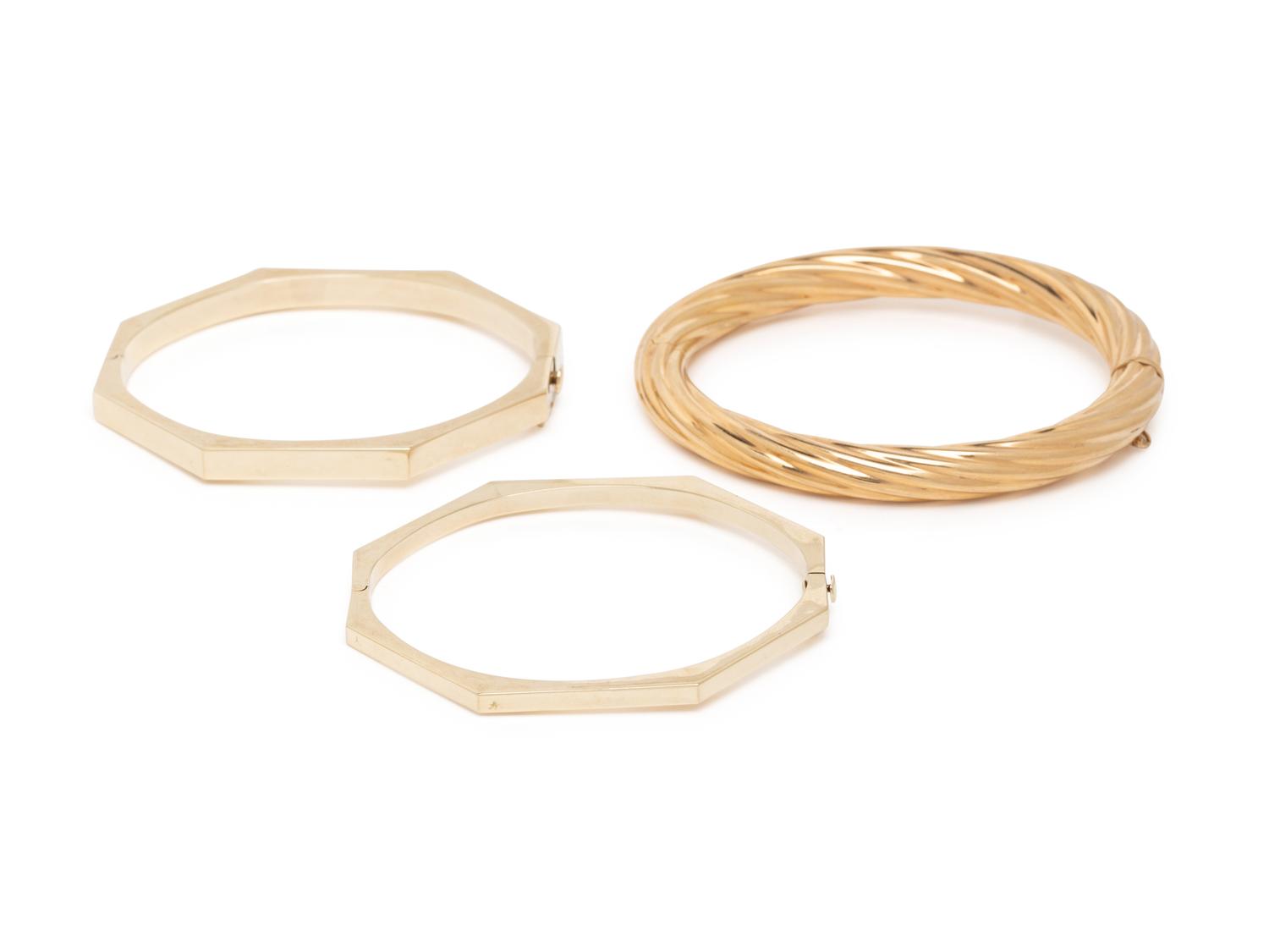 THREE YELLOW GOLD BANGLE BRACELETS