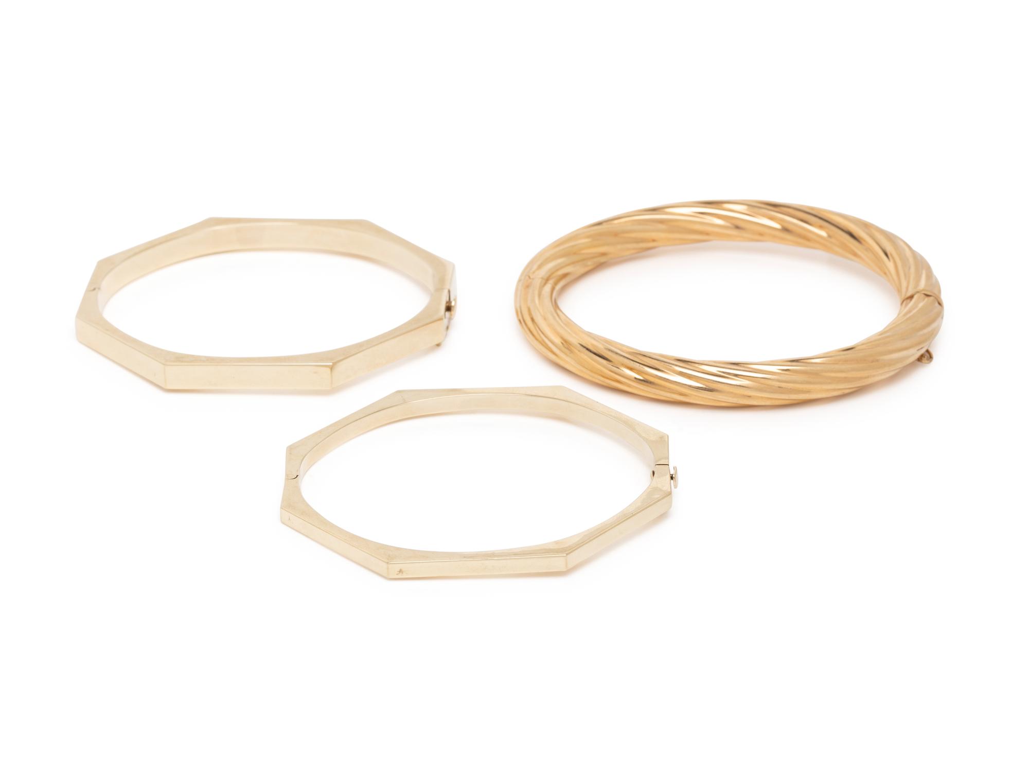 THREE YELLOW GOLD BANGLE BRACELETS