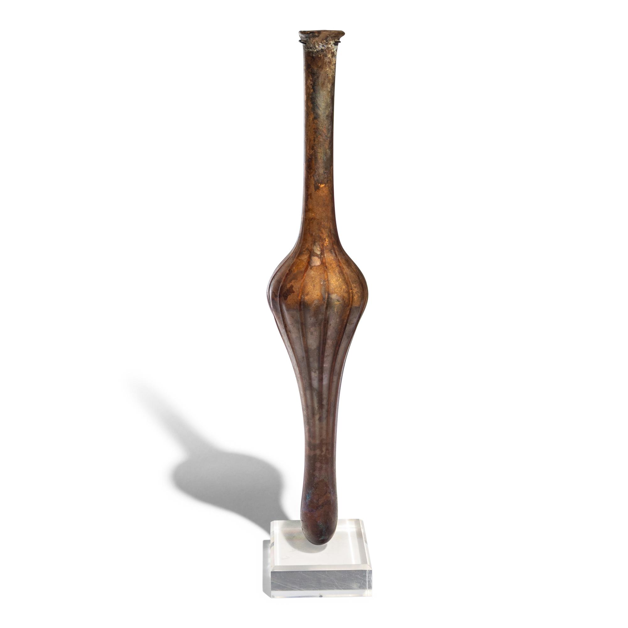 A Roman Aubergine Glass Unguentarium