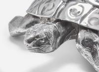 A sterling silver tortoise sculpture together with a silverplated crab, 20th century
