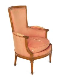 A Louis XVI Carved Walnut Bergère