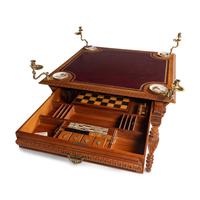 An Edwardian Oak Game Table