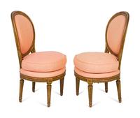 A Pair of Louis XVI Parcel-Gilt Petite Boudoir Chairs — 19TH CENTURY