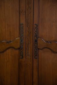 A French Provincial Carved Walnut Armoire