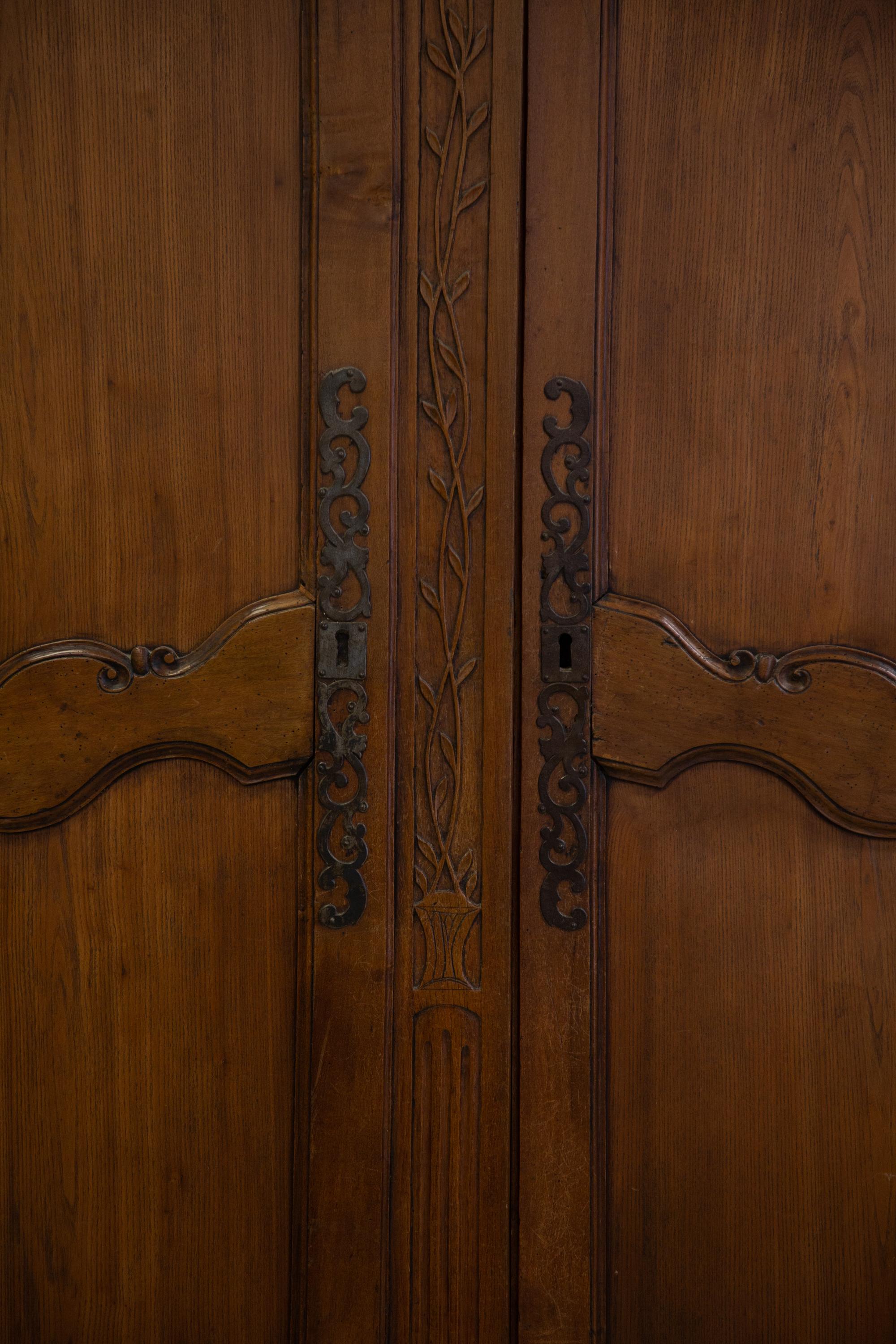 A French Provincial Carved Walnut Armoire