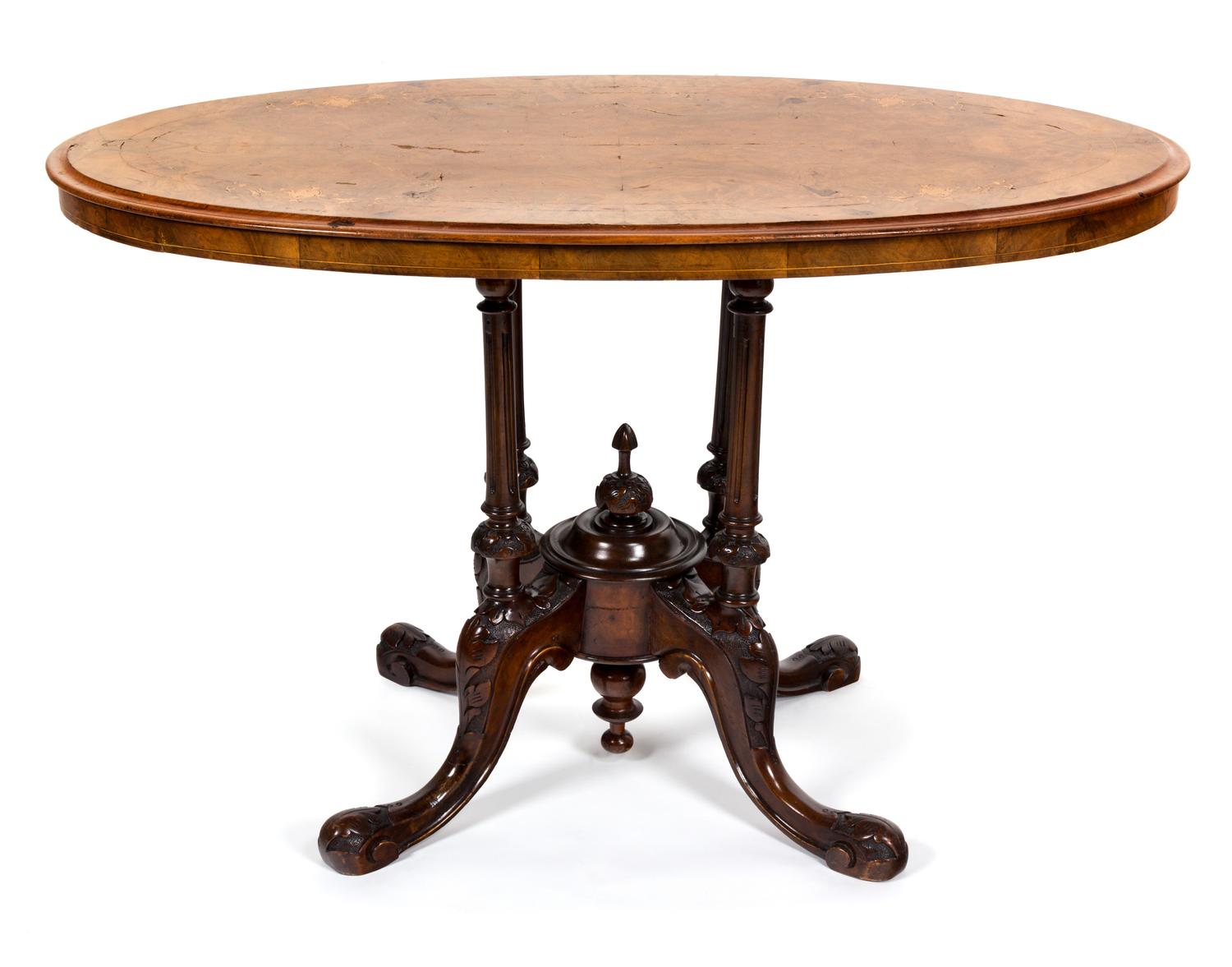 A Victorian Inlaid Walnut Center Table Height 25 1/2 x width 41 x depth 24 inches.