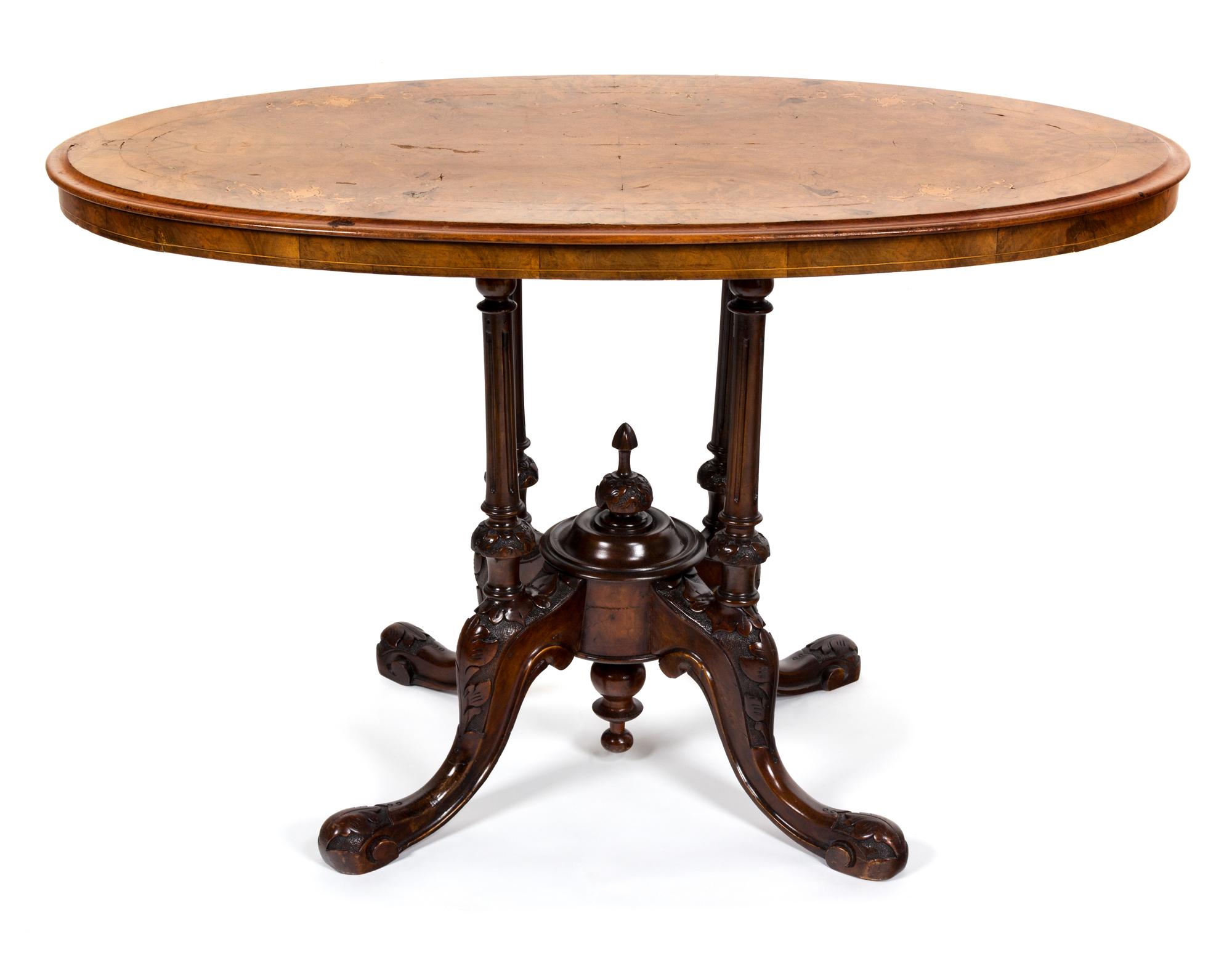 A Victorian Inlaid Walnut Center Table Height 25 1/2 x width 41 x depth 24 inches.