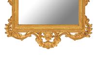 An Italian Baroque Style Giltwood Mirror