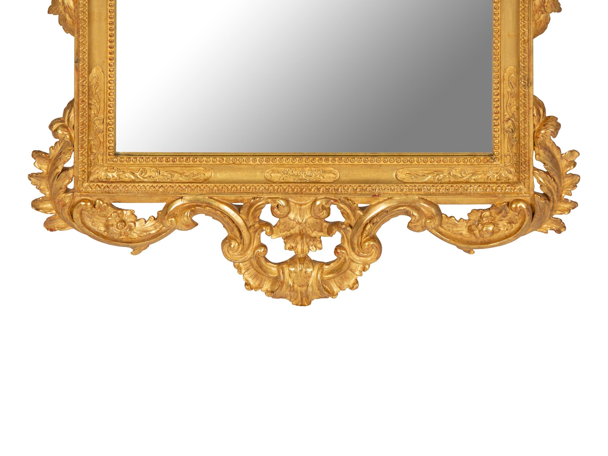 An Italian Baroque Style Giltwood Mirror