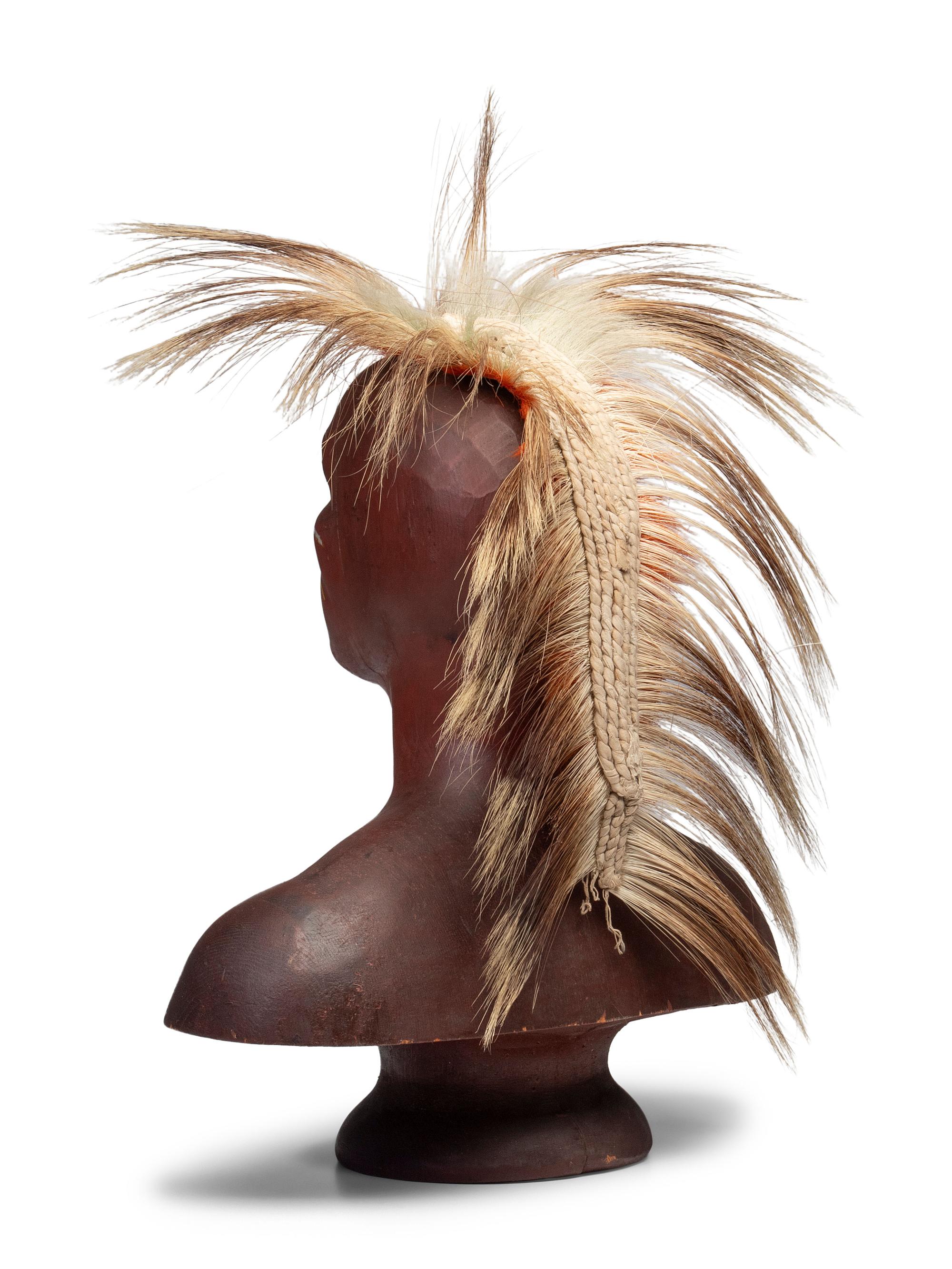 A Carved and Painted Pine Bust of a Native American