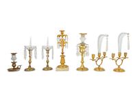 Seven Glass Mounted Brass Candlesticks
