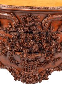 A Continental Floral-Carved and Painted Wood Commode