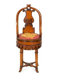 A Continental Parcel Ebonized Burled Walnut Music Chair