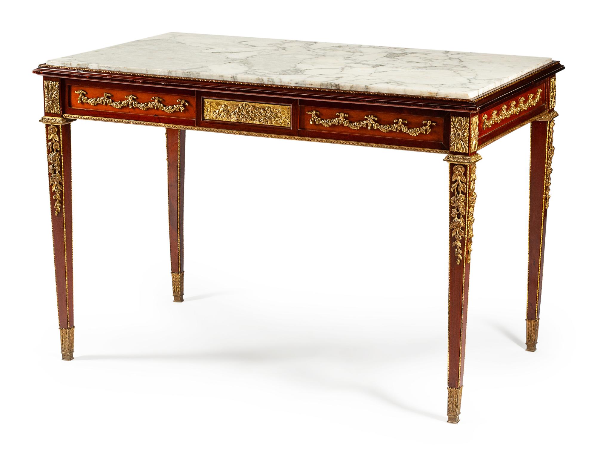 A Louis XVI Style Gilt Bronze Mounted Mahogany Table