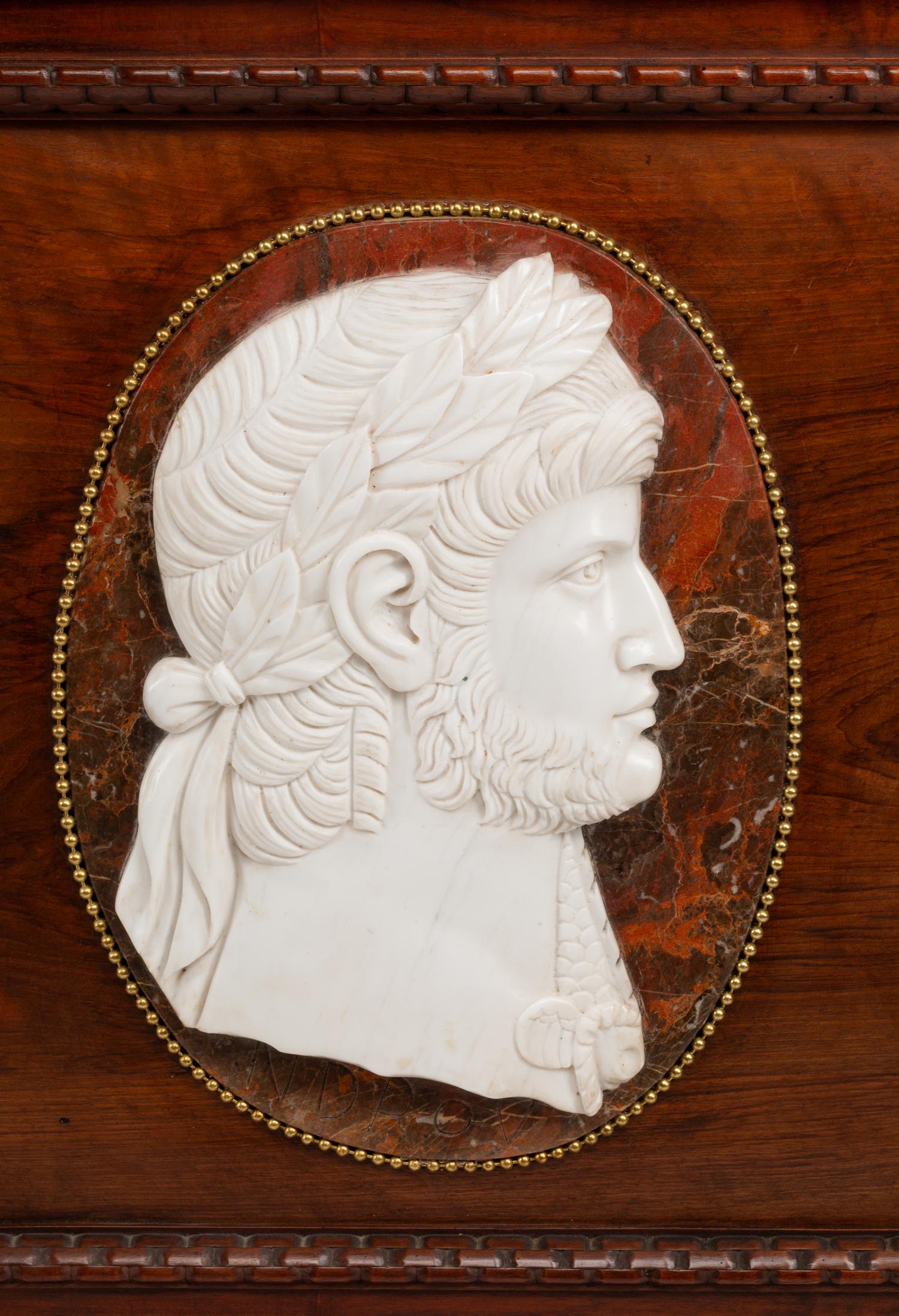 A Pair of Italian Carved Walnut Panels with Marble Profile Plaques