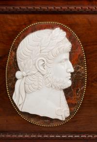 A Pair of Italian Carved Walnut Panels with Marble Profile Plaques