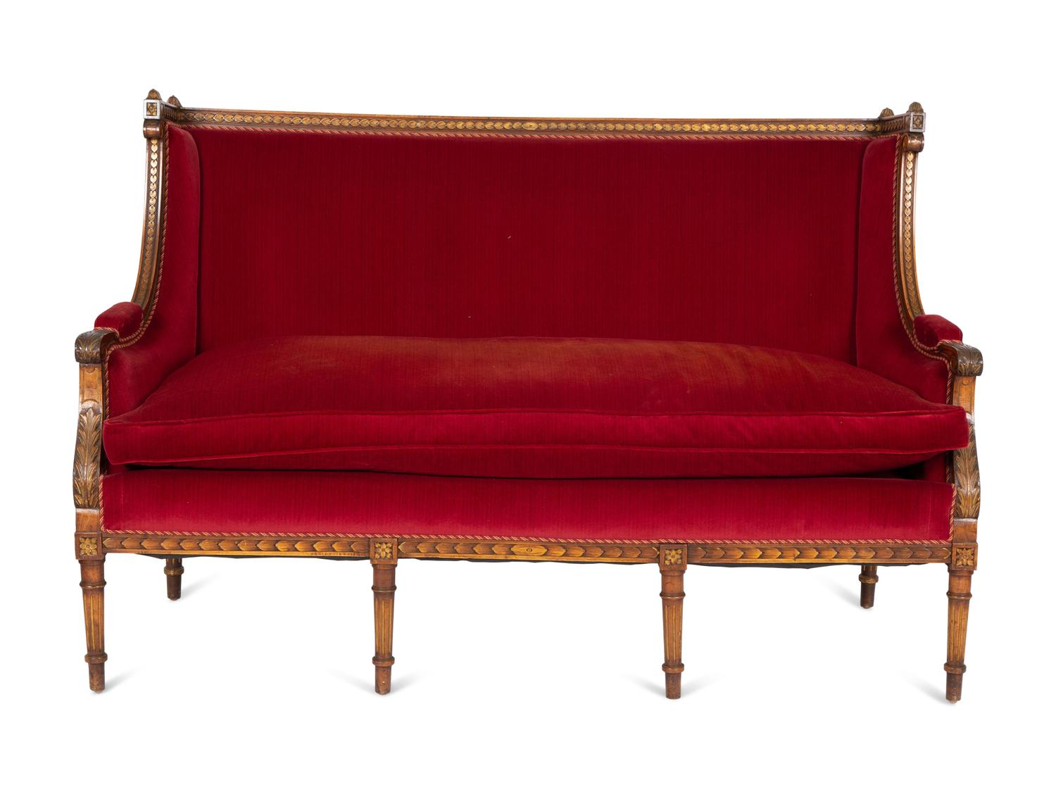 A Louis XVI Style Parcel Gilt Walnut Sofa