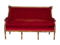 A Louis XVI Style Parcel Gilt Walnut Sofa