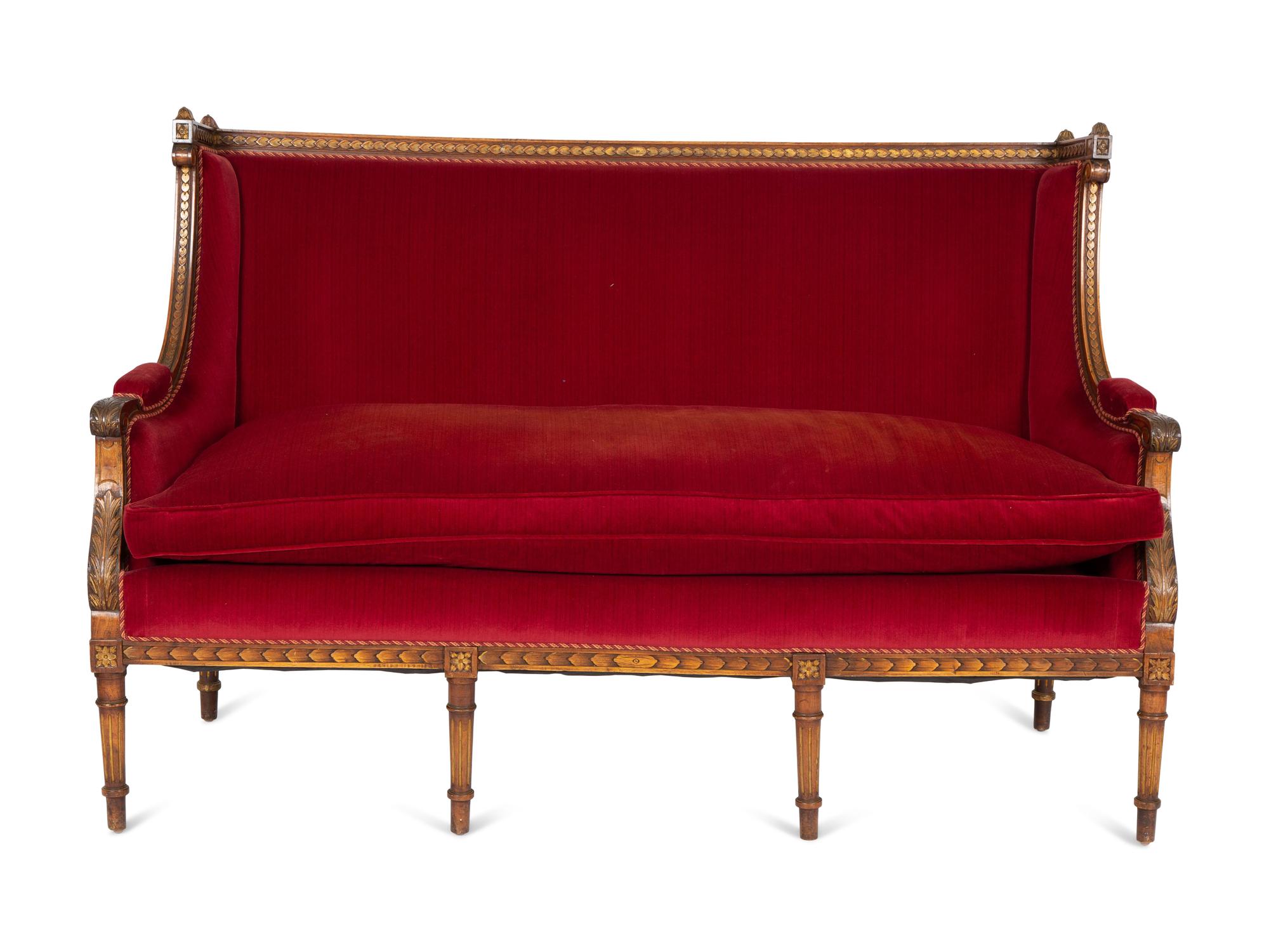 A Louis XVI Style Parcel Gilt Walnut Sofa