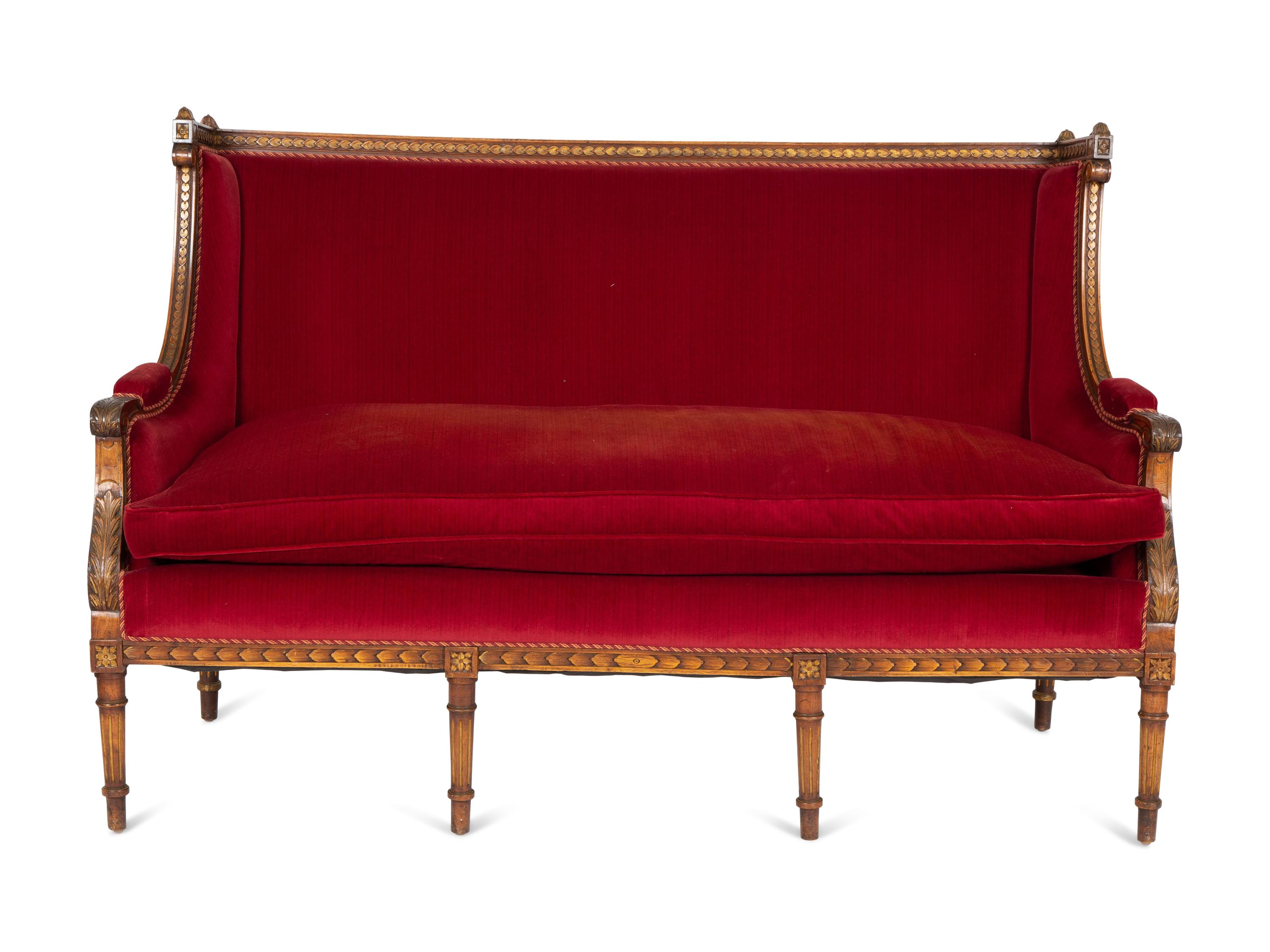A Louis XVI Style Parcel Gilt Walnut Sofa
