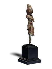 An Egyptian Bronze Concubine Holding a Duck