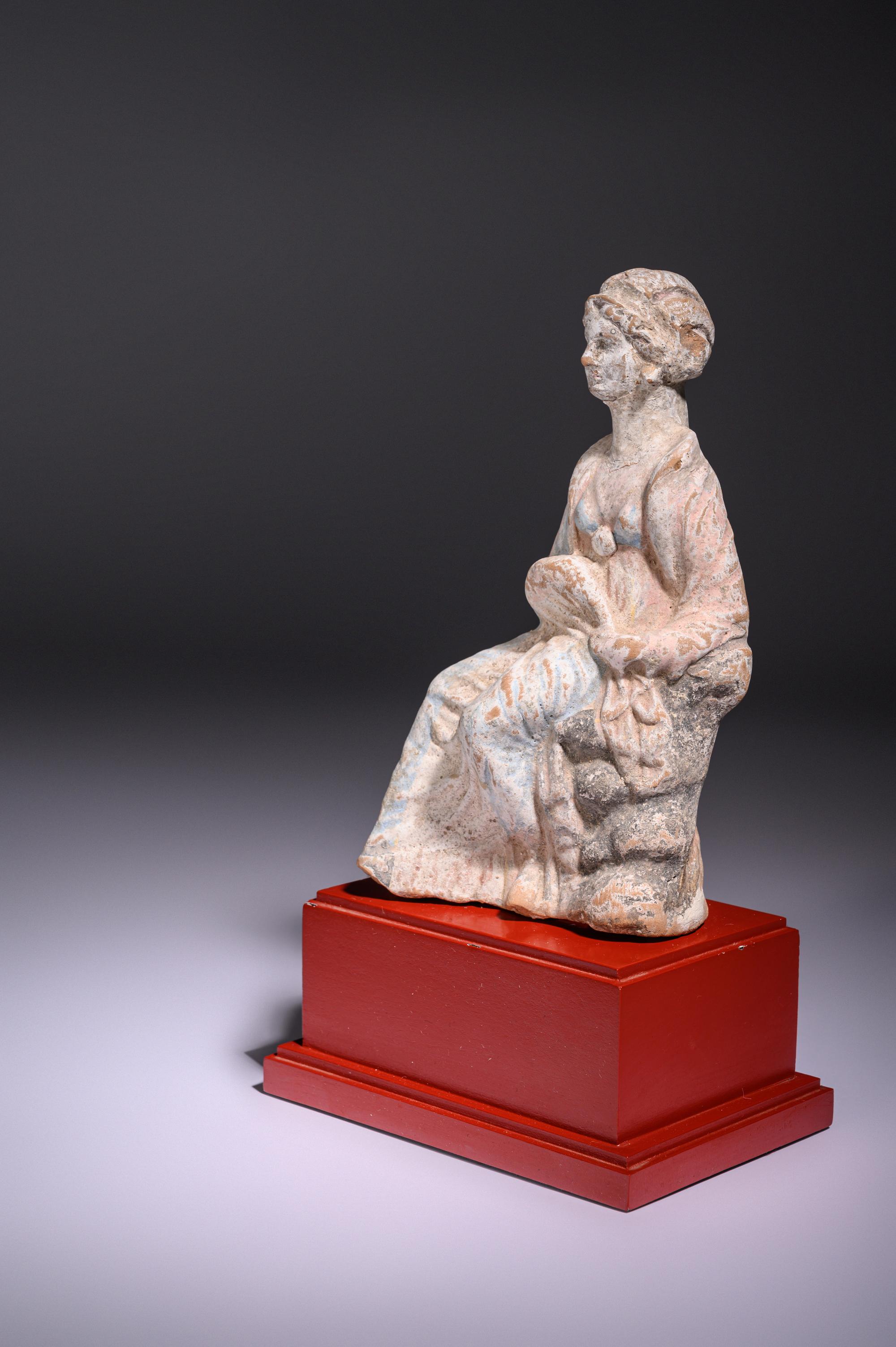 A Greek Terracotta Seated Woman