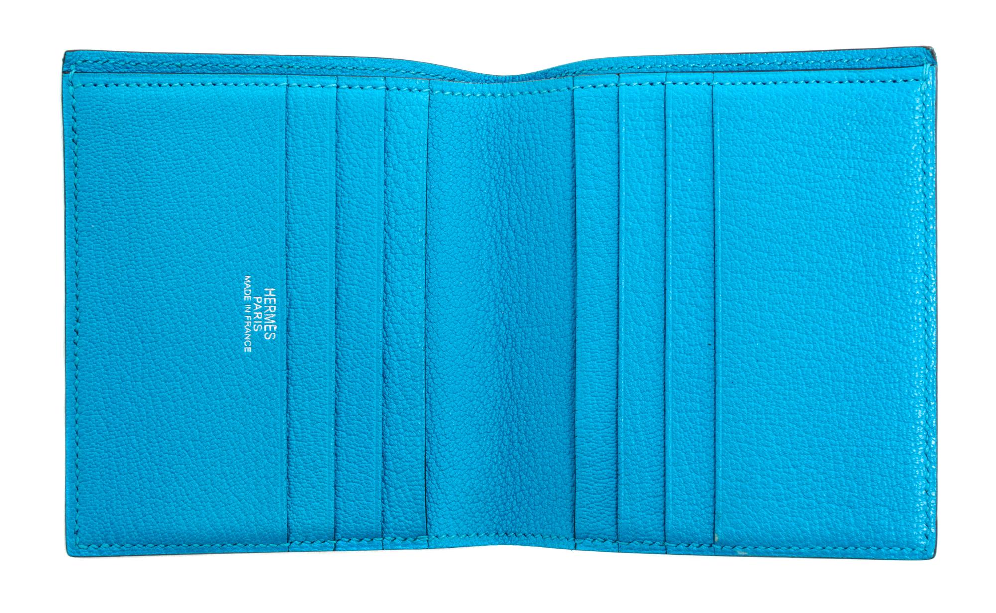 An Hermes Saint Cyr Blue Leather Evelyne Wallet, 4" x 4" x .25".