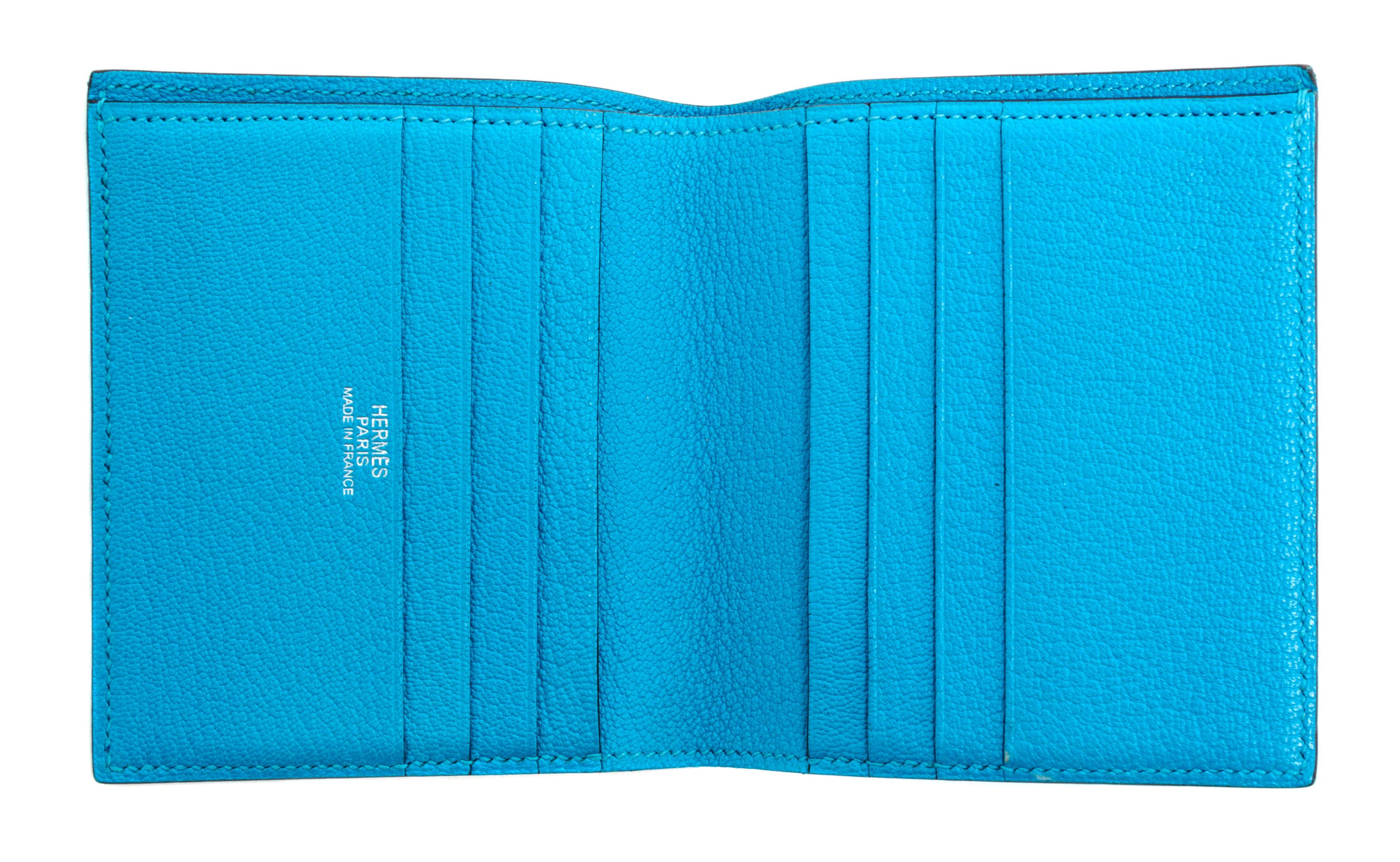 An Hermes Saint Cyr Blue Leather Evelyne Wallet, 4" x 4" x .25".