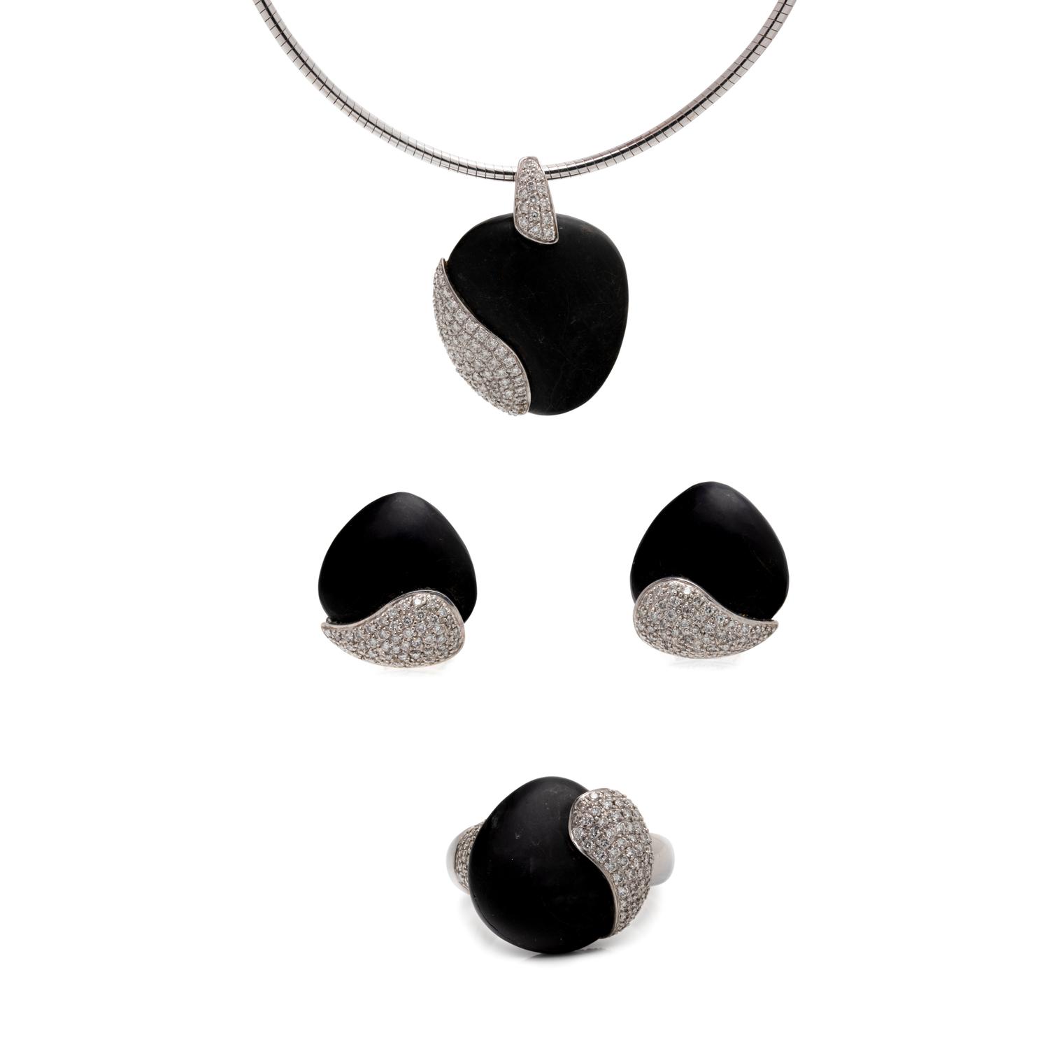 MOVADO, WHITE GOLD, PEBBLE AND DIAMOND SET