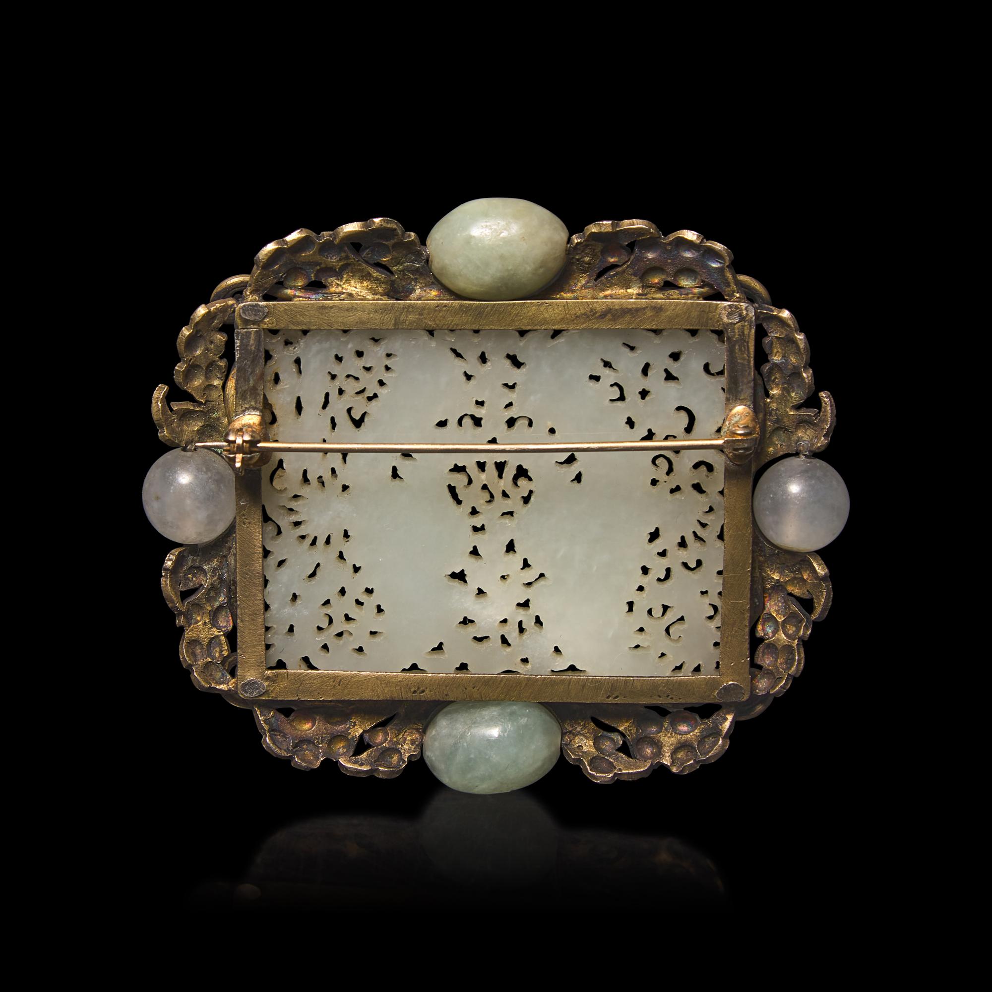A Chinese White Jade 'Double Phoenix' Belt Plaque, Ming Dynasty 明 白玉鏤雕雙鳳紋帶板