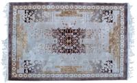 An Oriental Wool Rug 6 feet x 4 feet.