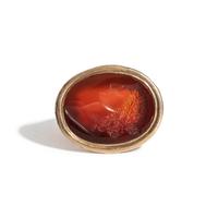 A Neoclassical Carnelian and Brass Finger Ring with a Bust of a Deity