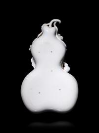 A Chinese White Glazed Porcelain Gourd-Form Brush Washer
