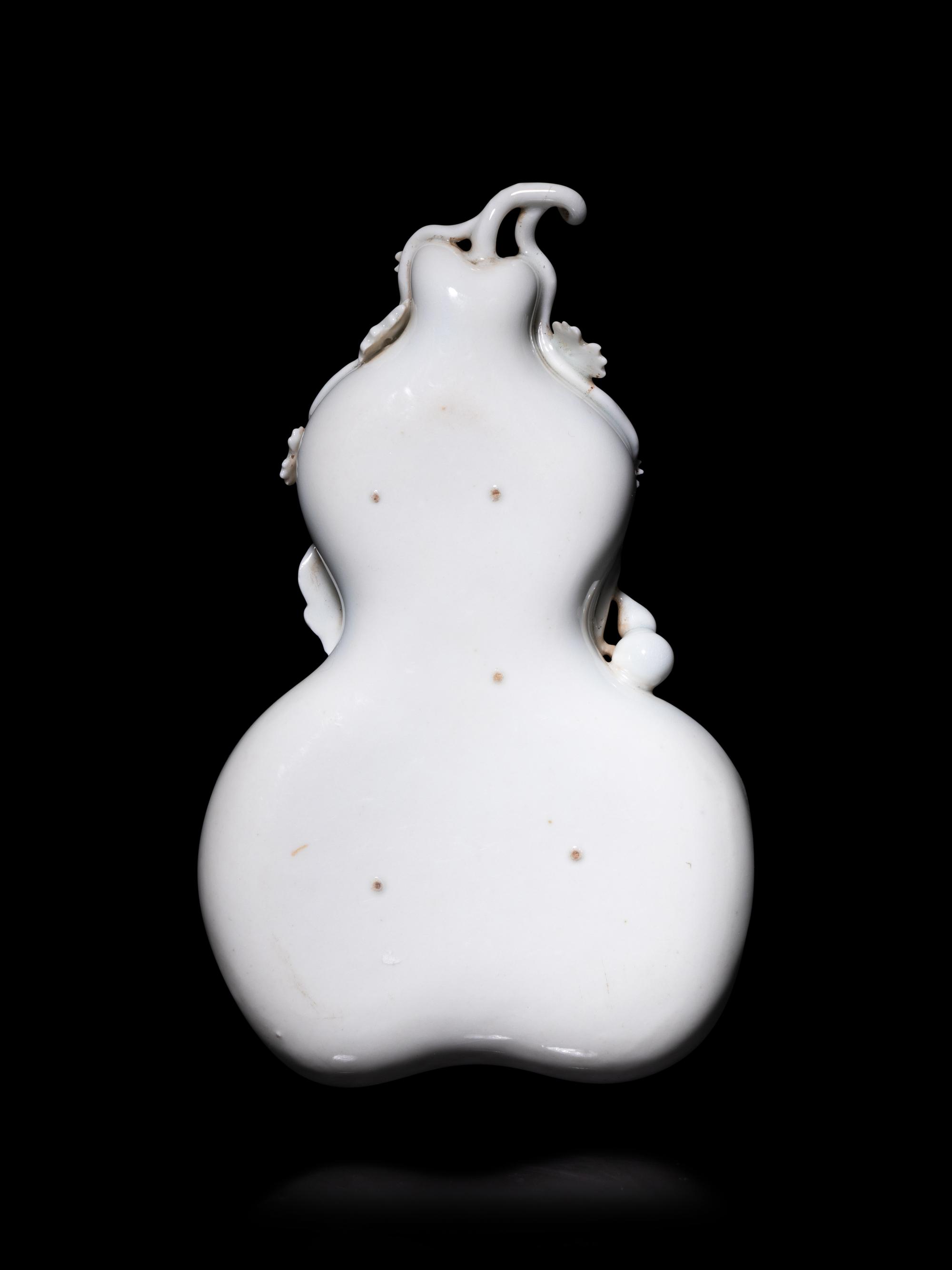 A Chinese White Glazed Porcelain Gourd-Form Brush Washer