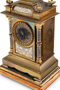 A French Brass and Mixed Metals Clock Garniture