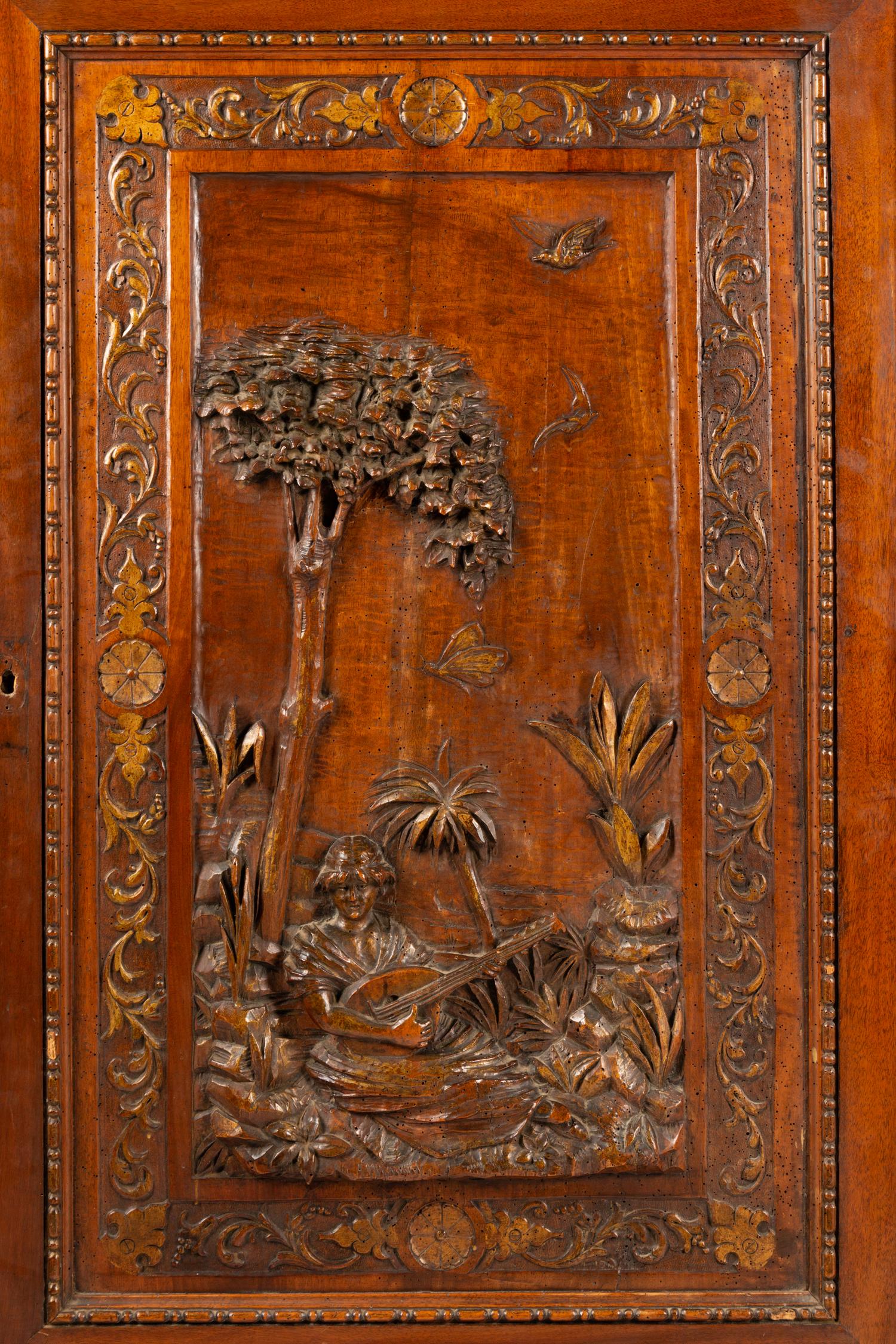 A Pair of French Renaissance Revival Parcel Gilt Cabinets