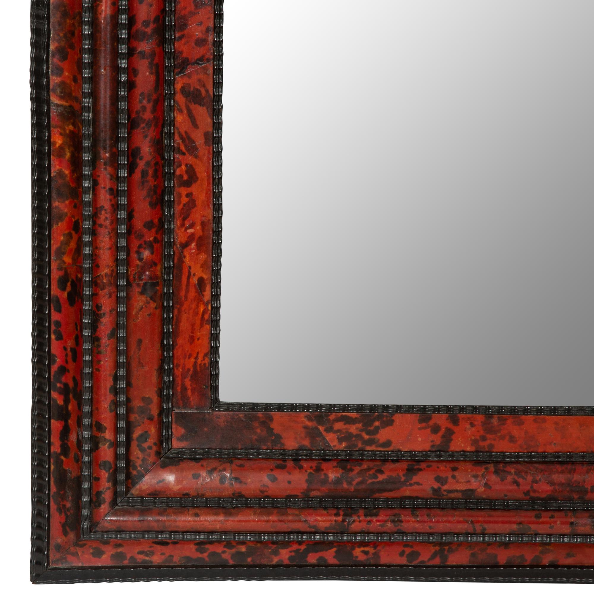 A Flemish Faux Tortoise Shell and Parcel Ebonized Mirror