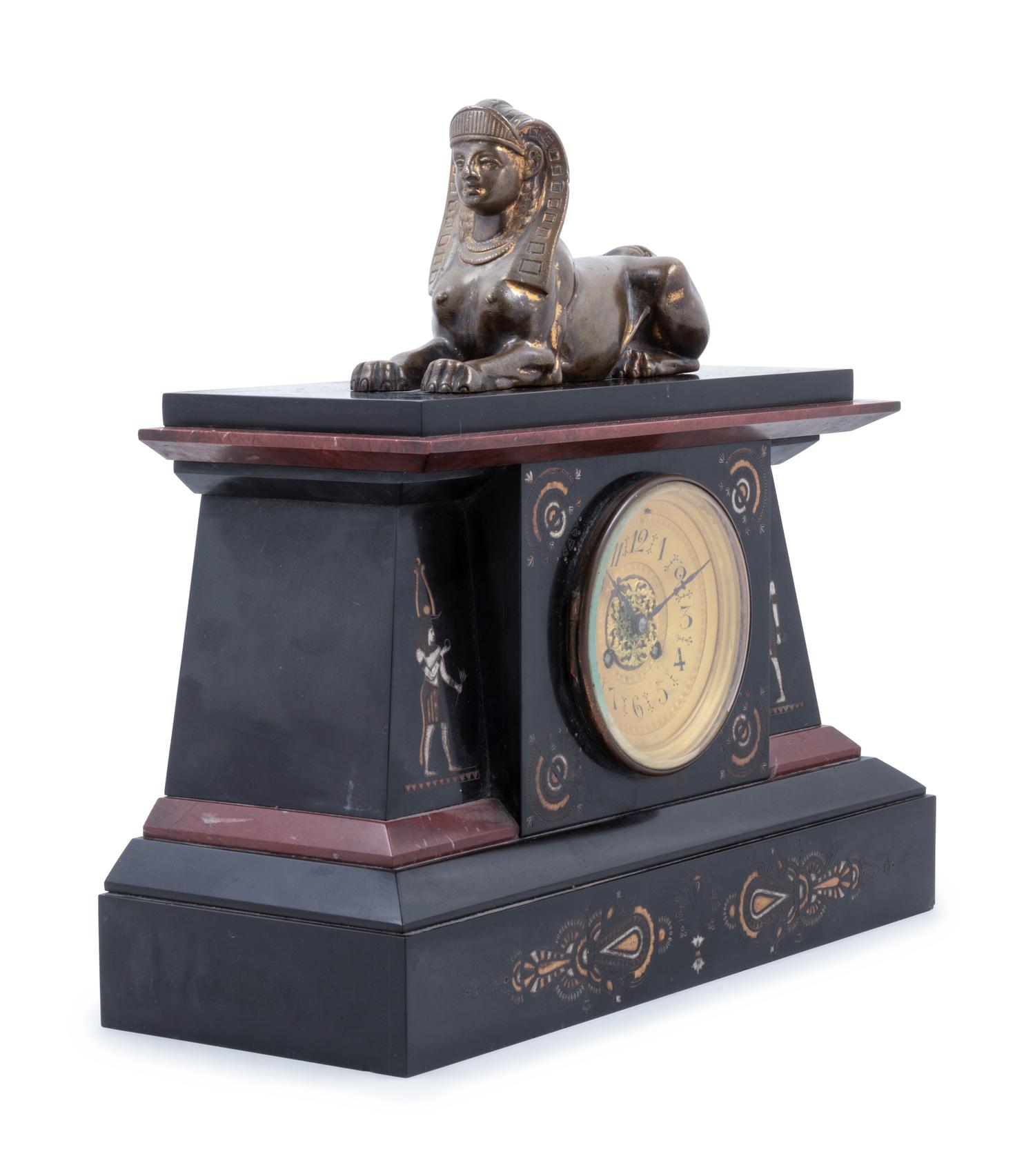 An Egyptian Revival Bronze Mounted and Parcel Gilt Mantel Clock